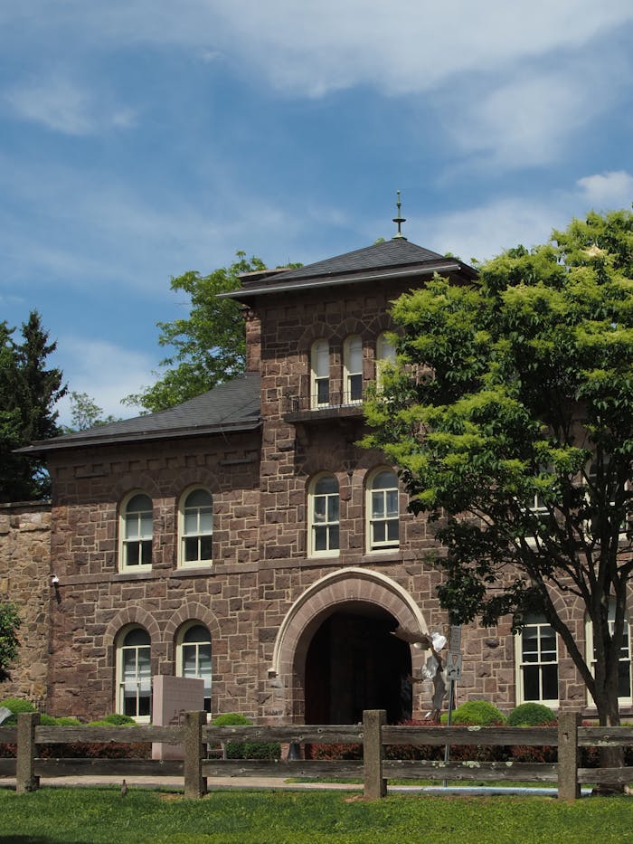 Charming historic stone architecture in Doylestown, Pennsylvania, under a clear blue sky.